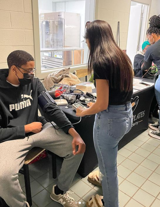 Student nurses provide blood pressure screenings at the Franciscan Center in West Baltimore, Monday, January 16, 2023