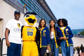 President Jenkins with Coppin's mascot