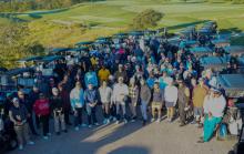 Golfers with dozens of golf carts